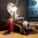 Επιτραπέζιο φωτιστικό κόκκινο που μοιάζει με φωτογραφική μηχανή